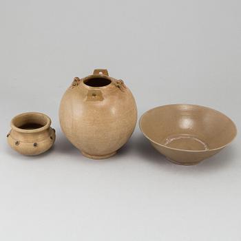 A brown glazed bowl and two pots, South East Asia, 17th Century or older.