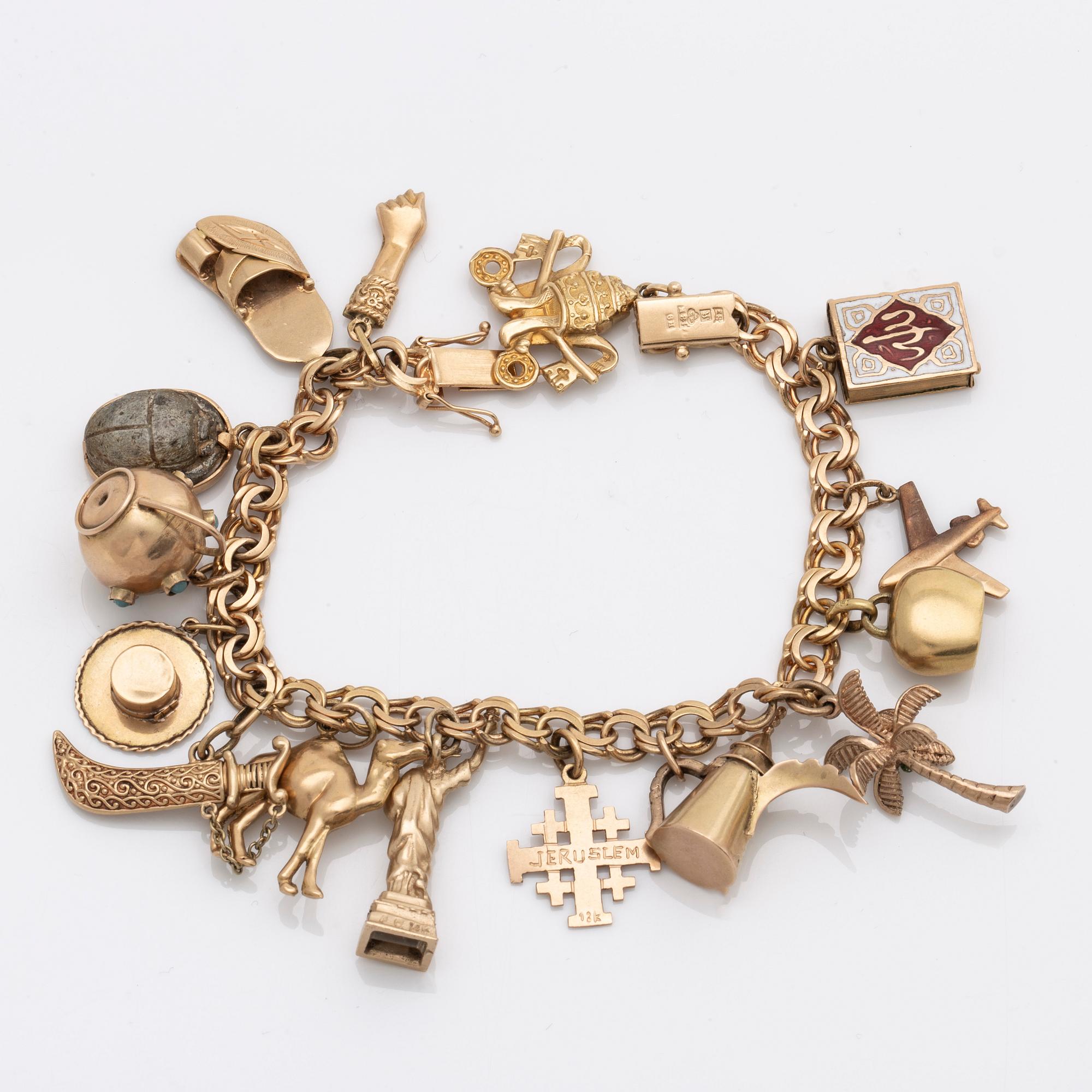 BRACELET with charms, 18K gold, approx 17,5 x 0,5 cm, 35,3 g.