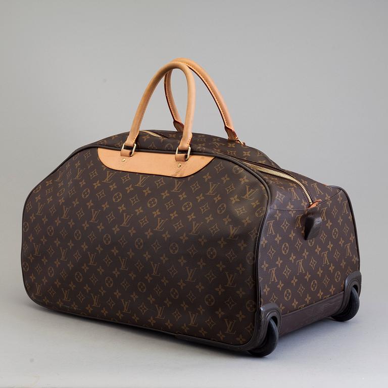 A bag Eole 50 Rolling Carry On, Louis Vuitton.