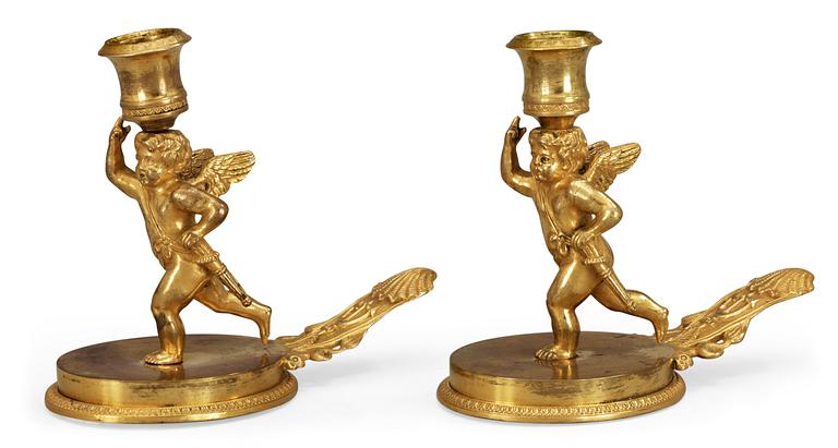 A pair of Russian ca 1815 gilt bronze candlesticks.