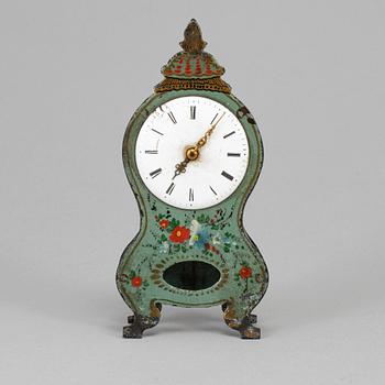 A 19th century tin plate miniature table clock.