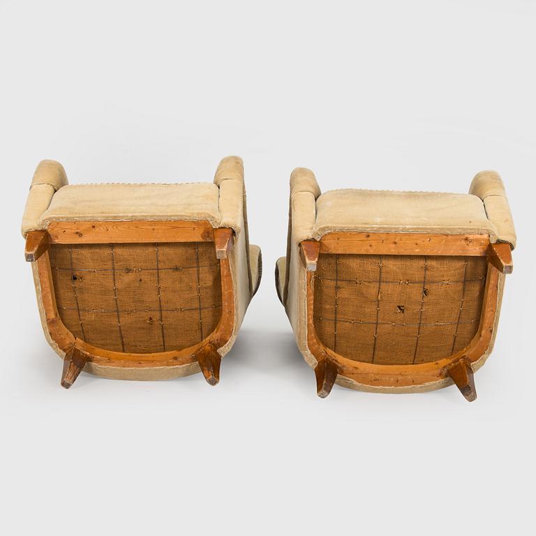 A pair of mid-20th century armchairs.