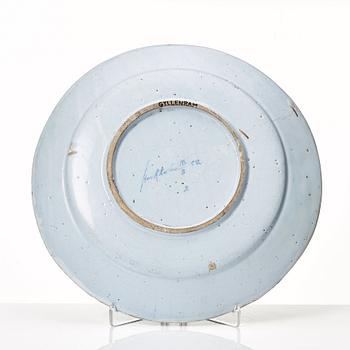 A large Swedish armorial serving dish with the arms of Gyllenram, dated Stockholm 18/8 1752.