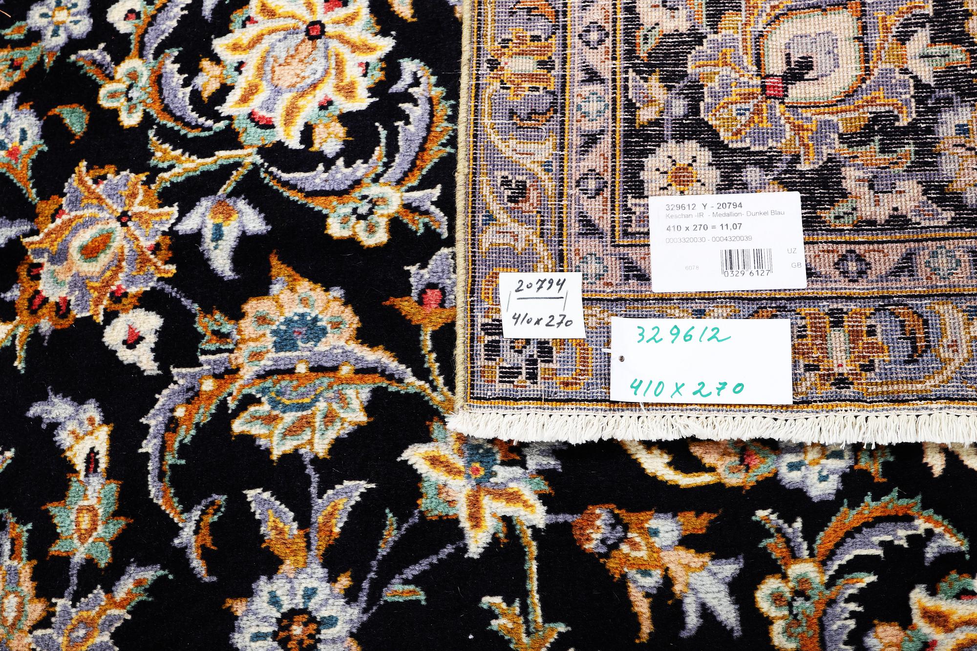 A Kashan carpet, signed, c. 410 x 270 cm.