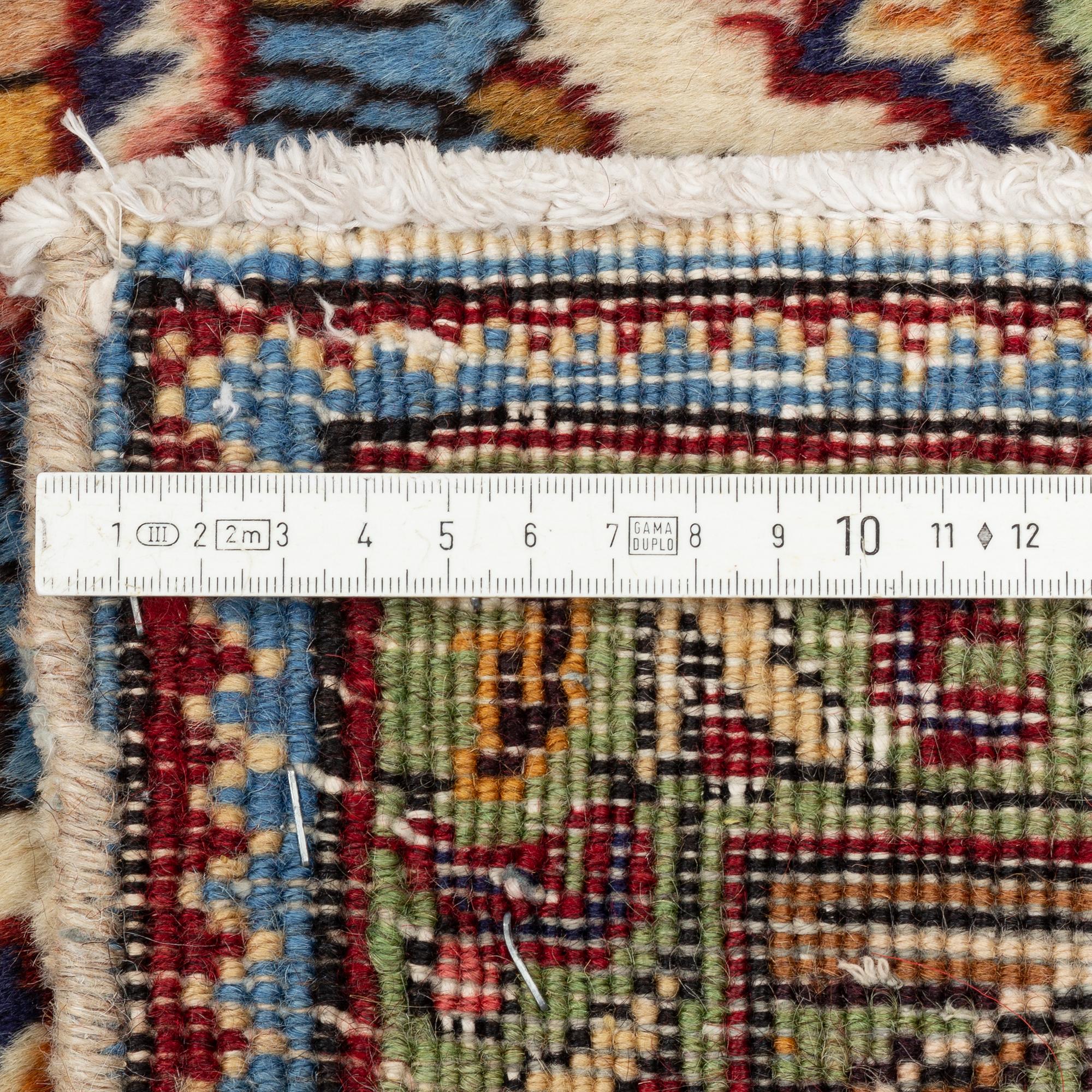 A Tabriz carpet, 309 x 205 cm.