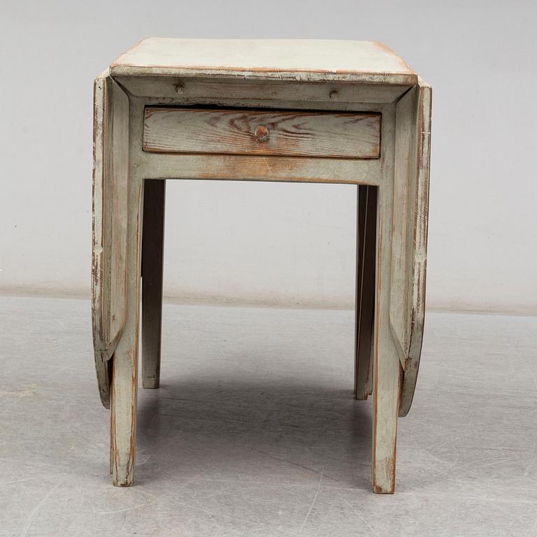 A gate-legged table from the mid 19th century.