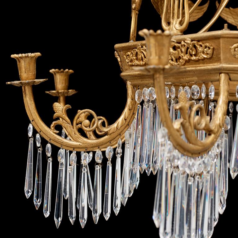A German 19th century sixteen-light chandelier in the manner of Karl Friedrich Schinkel.