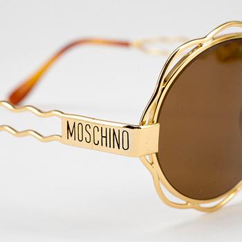 MOSCHINO, a pair of sunglasses.