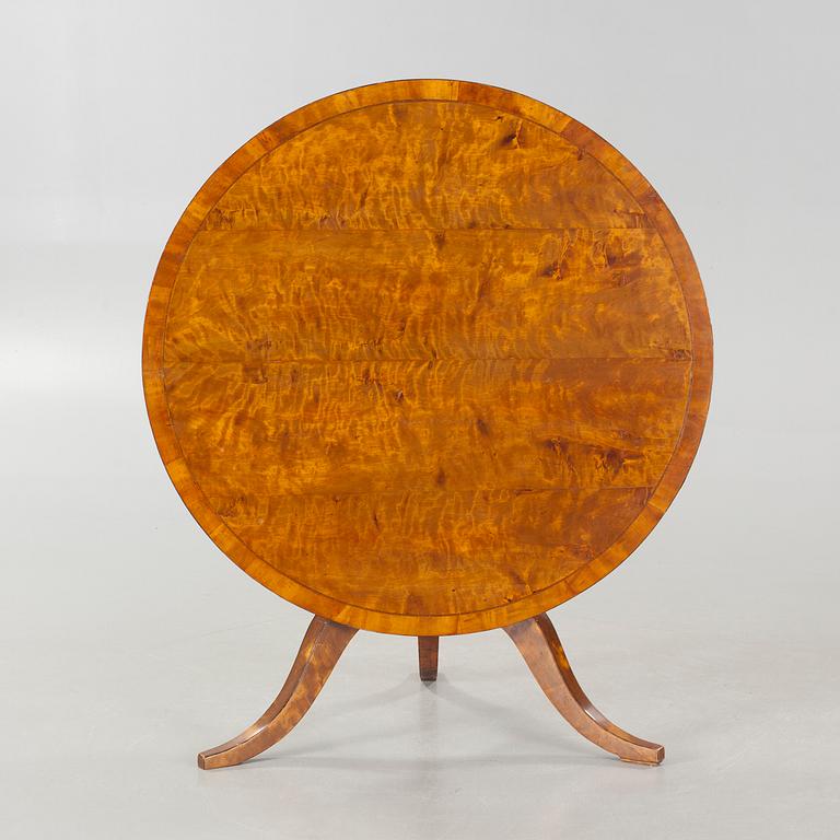 A 19th century drop-leaf table.