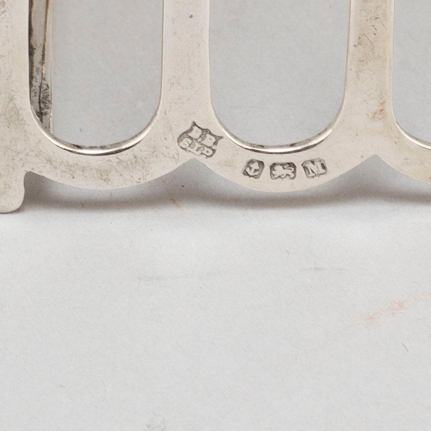 a set of four silver toastracks, Barker Brothers Birmingham 1936.