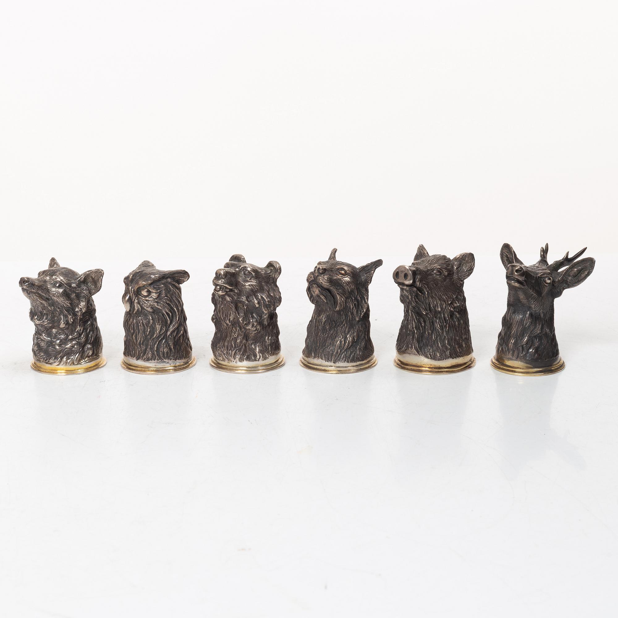Six Russian parcel-gilt silver animal's head stirrup cups, including with mark of Nikols & Plinke, St. Petersburg.
