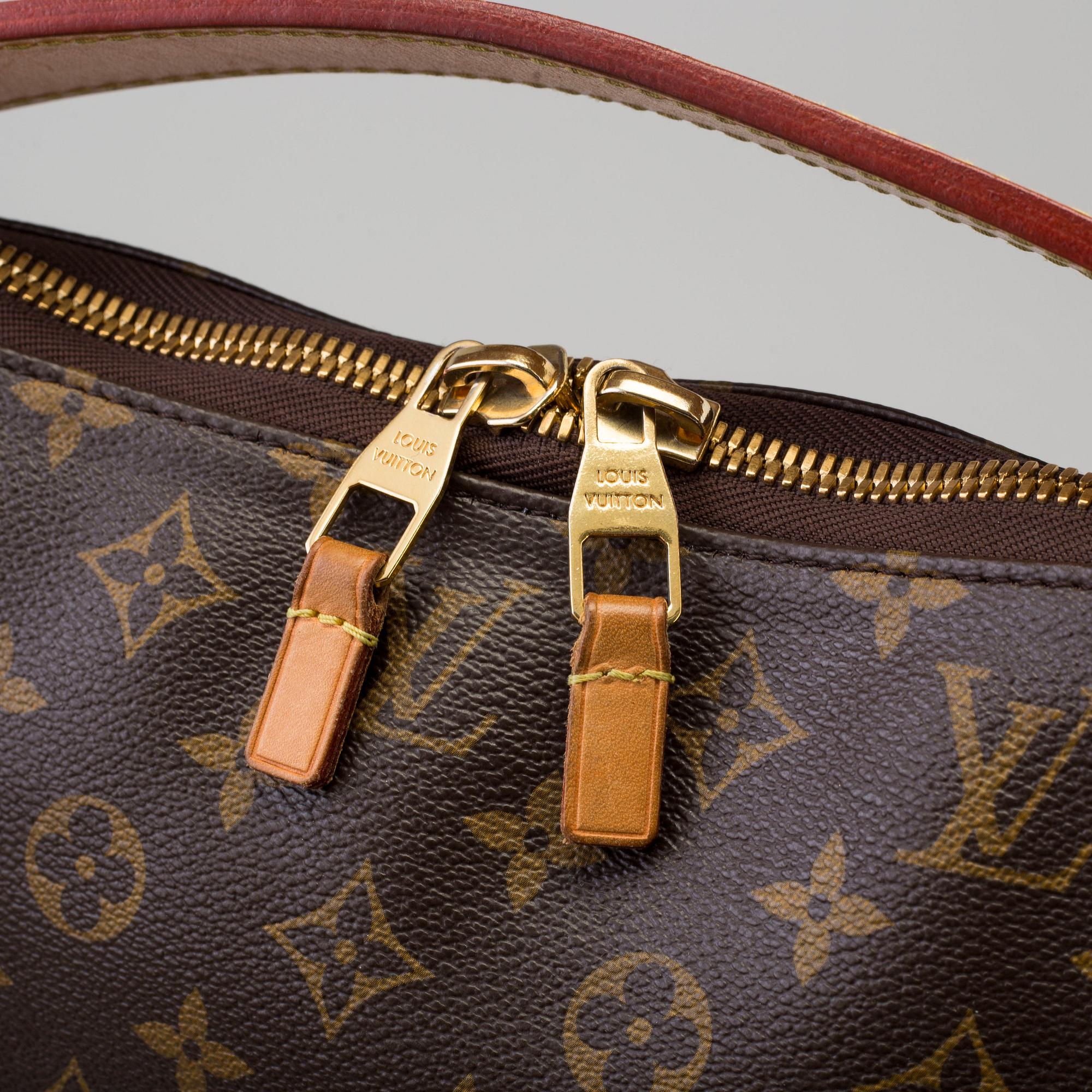 a LOUIS VUITTON 'Sully PM' bag.