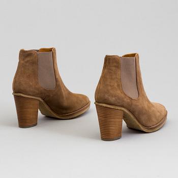 A pair of suede bootie byRalph Lauren.