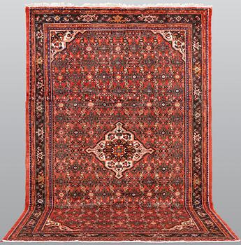 A Hosseinabad carpet,, ca 310 x 210 cm.