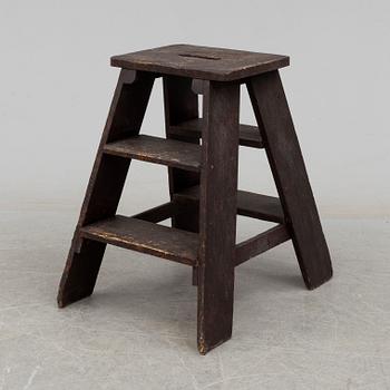 a late 19th century pinewood stool.