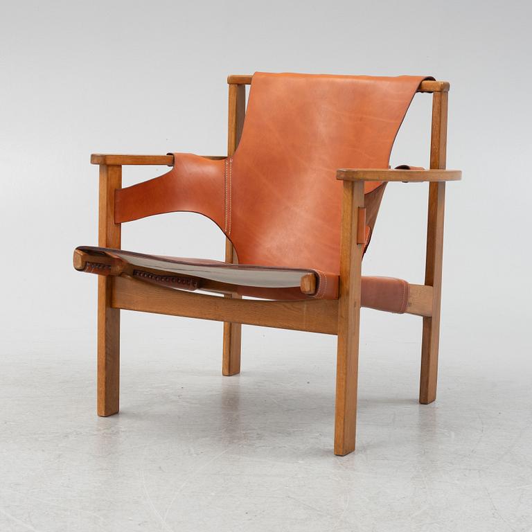 Carl-Axel Acking, a 'Trienna' oak and leather easy chair, mid 20th Century.