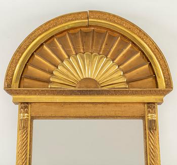 An Empire mirror from the first half of the 19th century.