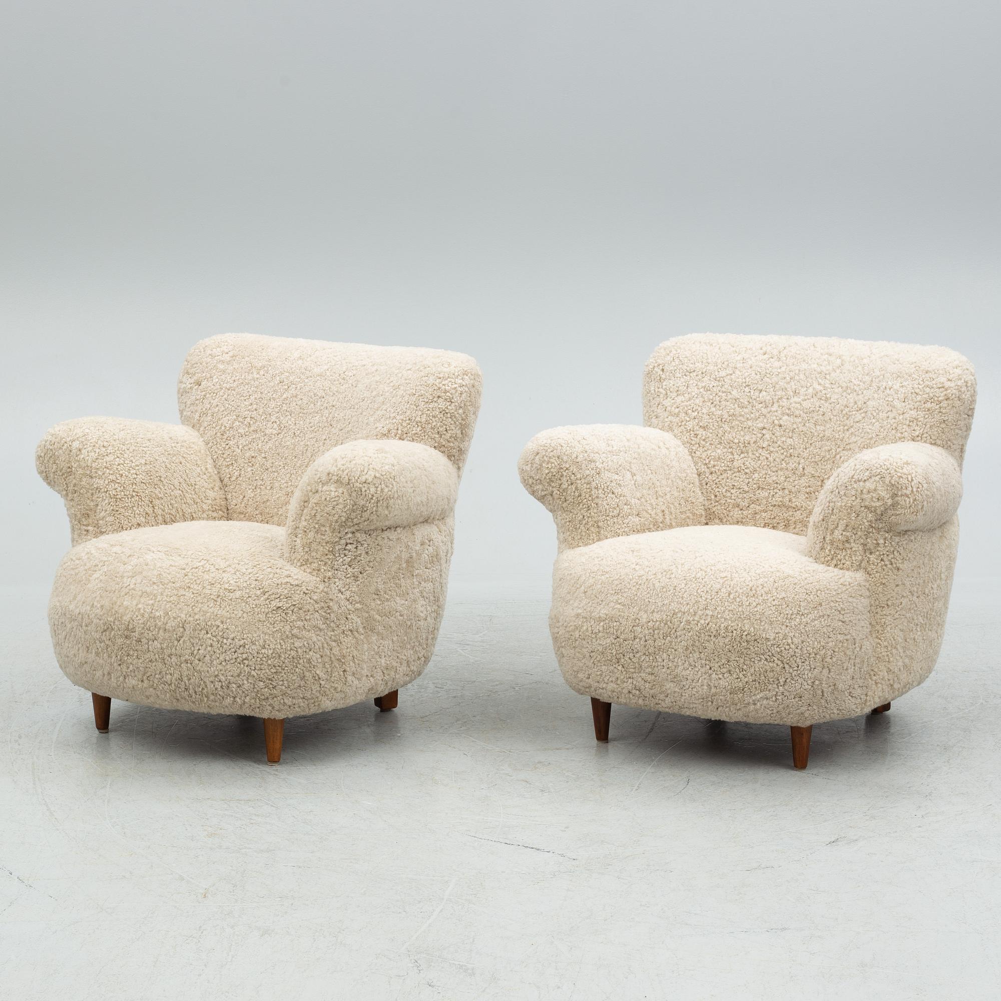 A pair of Swedish Modern easy chairs, mid 20th century.