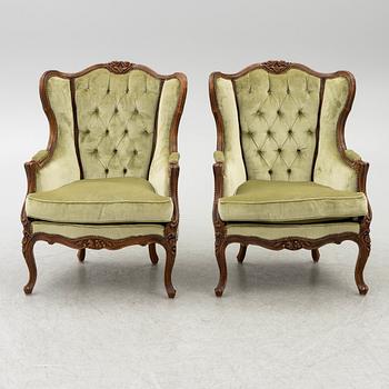 A pair of bergère armchairs, rococo-style, first half of te 20th century.