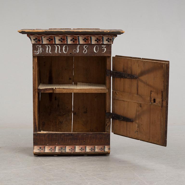 An early 19th century wall cabinet.