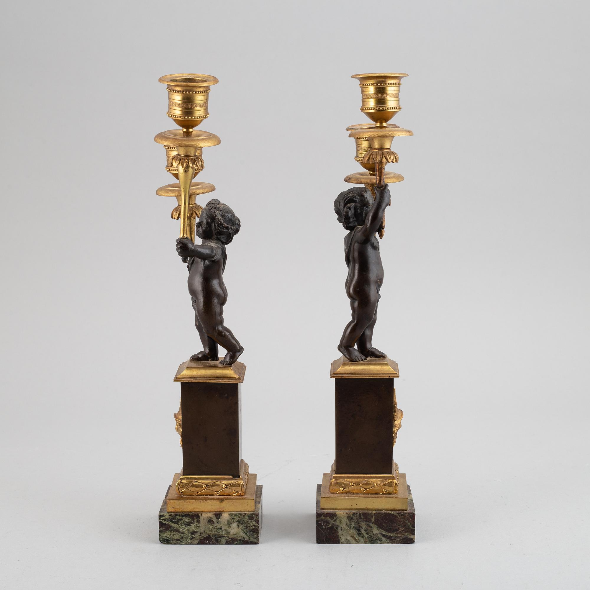 A pair of bronze empire style candleabra, 20th century.