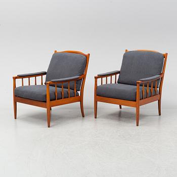 A pair of Swedish stained beech easy chairs, second half of the 20th Century.