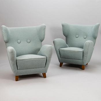 A pair of mid 20th century armchairs.