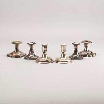 A set of three pair of Swedish 20th century silver candle sticks.