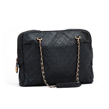 CHANEL, a darkblue leather shoulder bag, 1980s.
