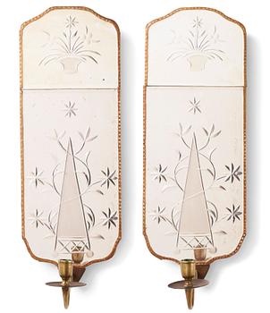 A pair of Gustavian-style giltwood and engraved glass one-light girandole mirrors, circa 1900.
