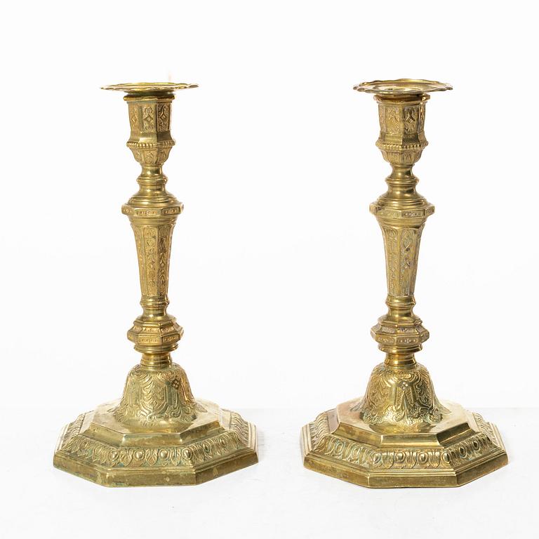 A pair of Louis XVI-style brass candle sticks, first half of the 20th century.
