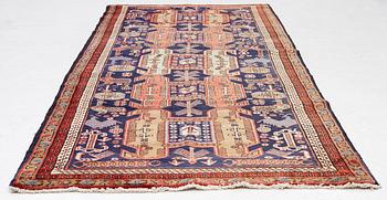 A Sarab carpet, c. 305 x 137 cm.