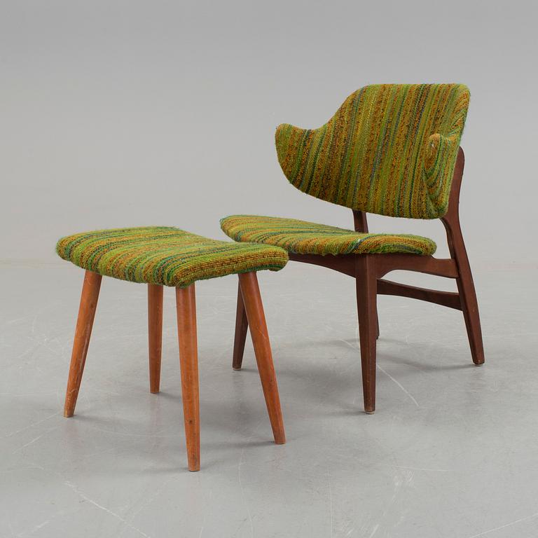 An IKEA armchair with a stool.