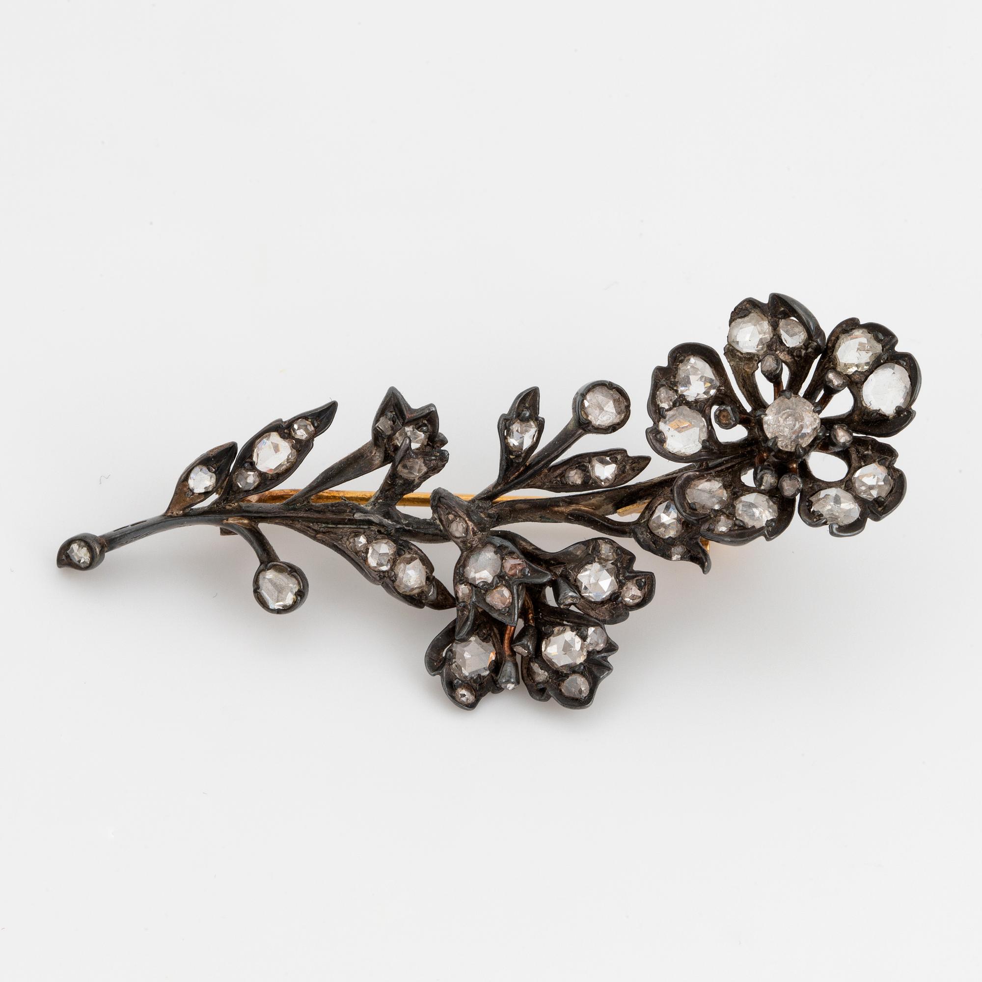 Silver and rose-cut diamond flower brooch.
