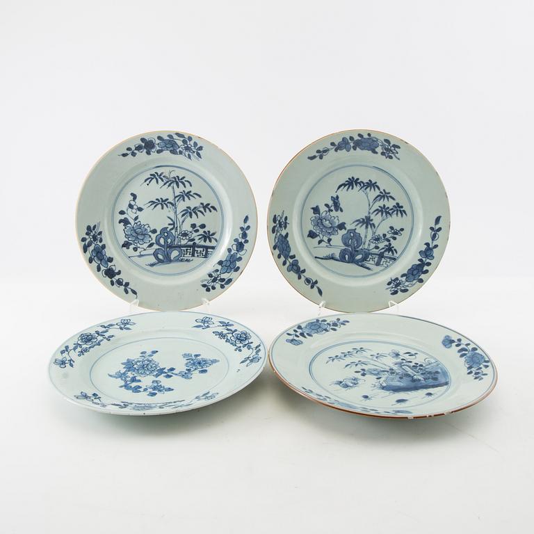 A matched set of four blue and white dinner plates, Qing dynasty, Qianlong (1736-95).