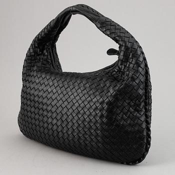 Bottega Veneta, a black leather bag.