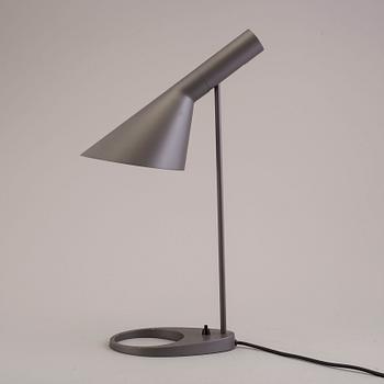 An Arne Jacobsen "AJ" table lamp.