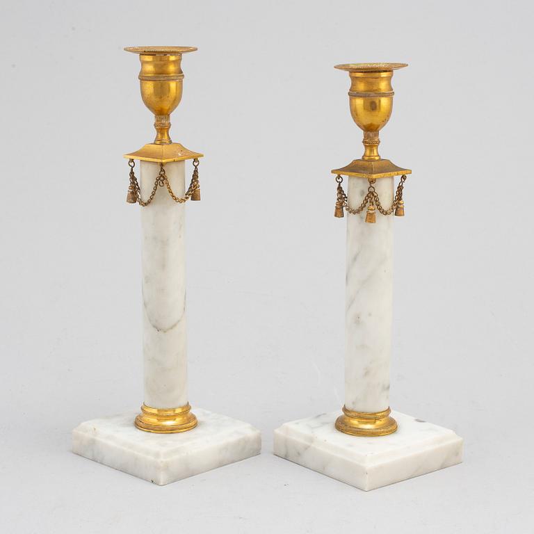 A pair of Gustavians style marble candlesticks, early 20th Century.