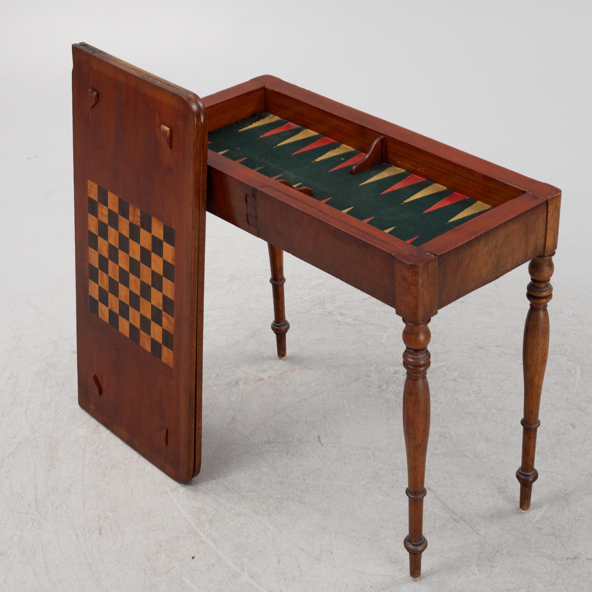 A mahogany games table, mid 19th Century.