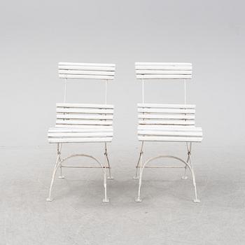 A garden sofa and four chairs, mid 20th Century.