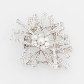 An 18K white gold brooch set with cultured pearls and round brilliant-, eight- and rose-cut diamonds.