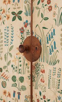 A Josef Frank mahogany cabinet, doors and sides covered in Frank's floral chintz fabric 'Fatima', Svenskt Tenn ca 1937.