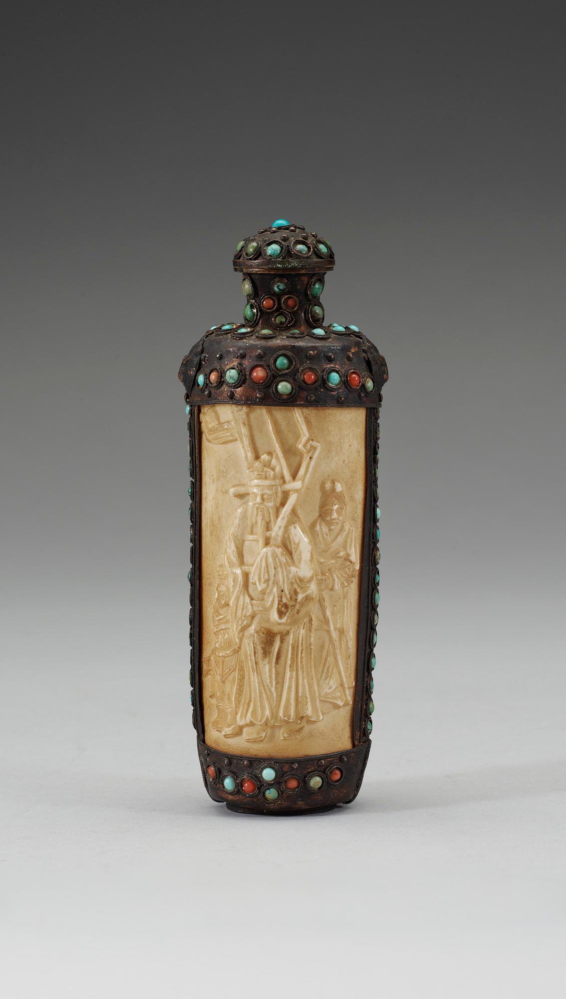 A turquoise inlayed metal framed ivory flask, late Qing dynasty (1644-1911).