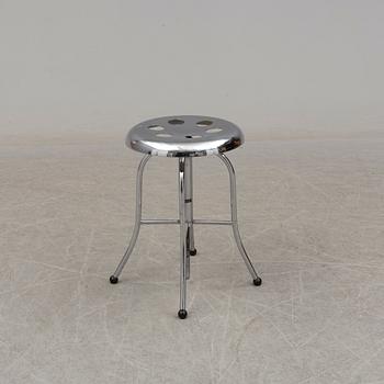 A chromed metal Stille stool.