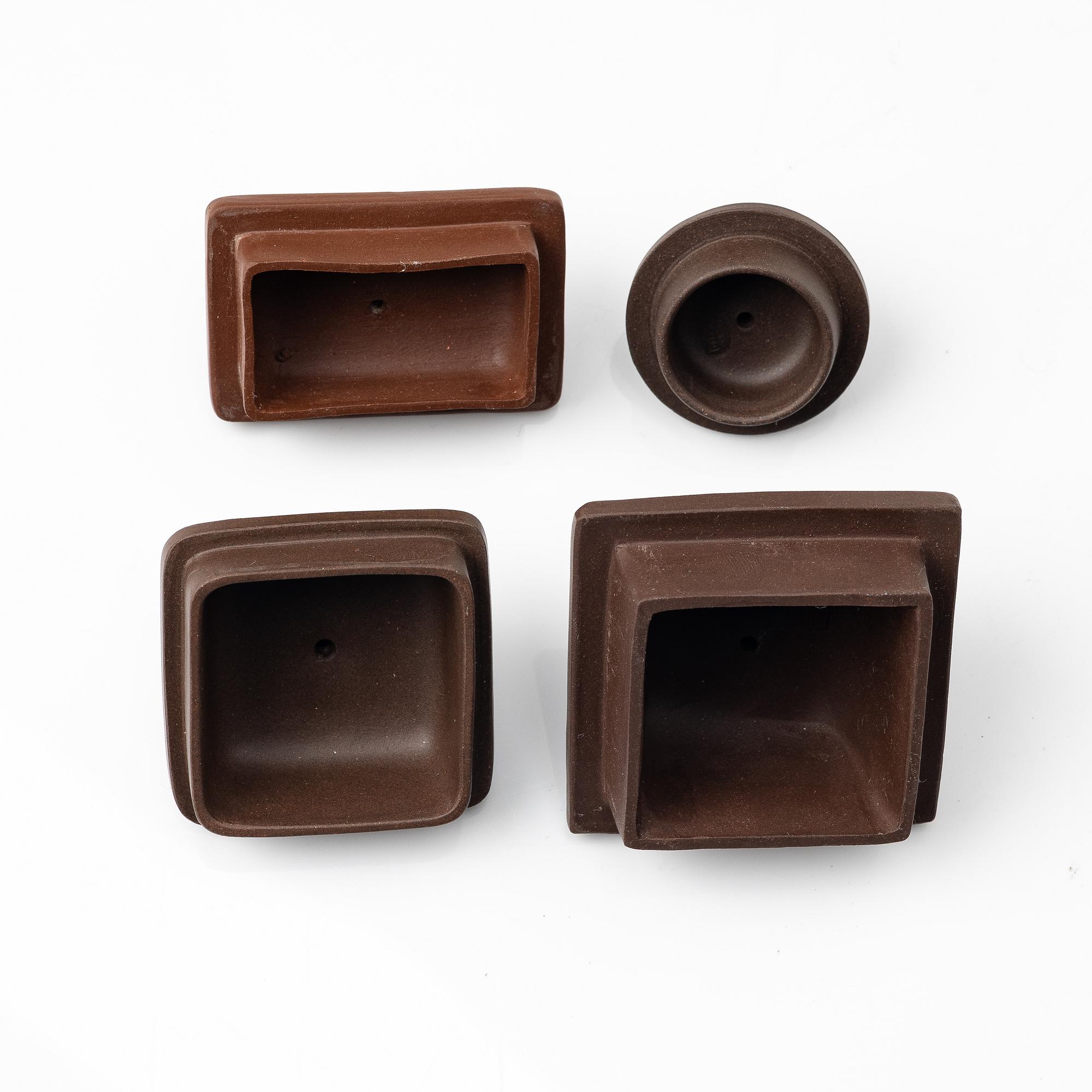 A group of four square yixing teapots, China, 1970/80s.