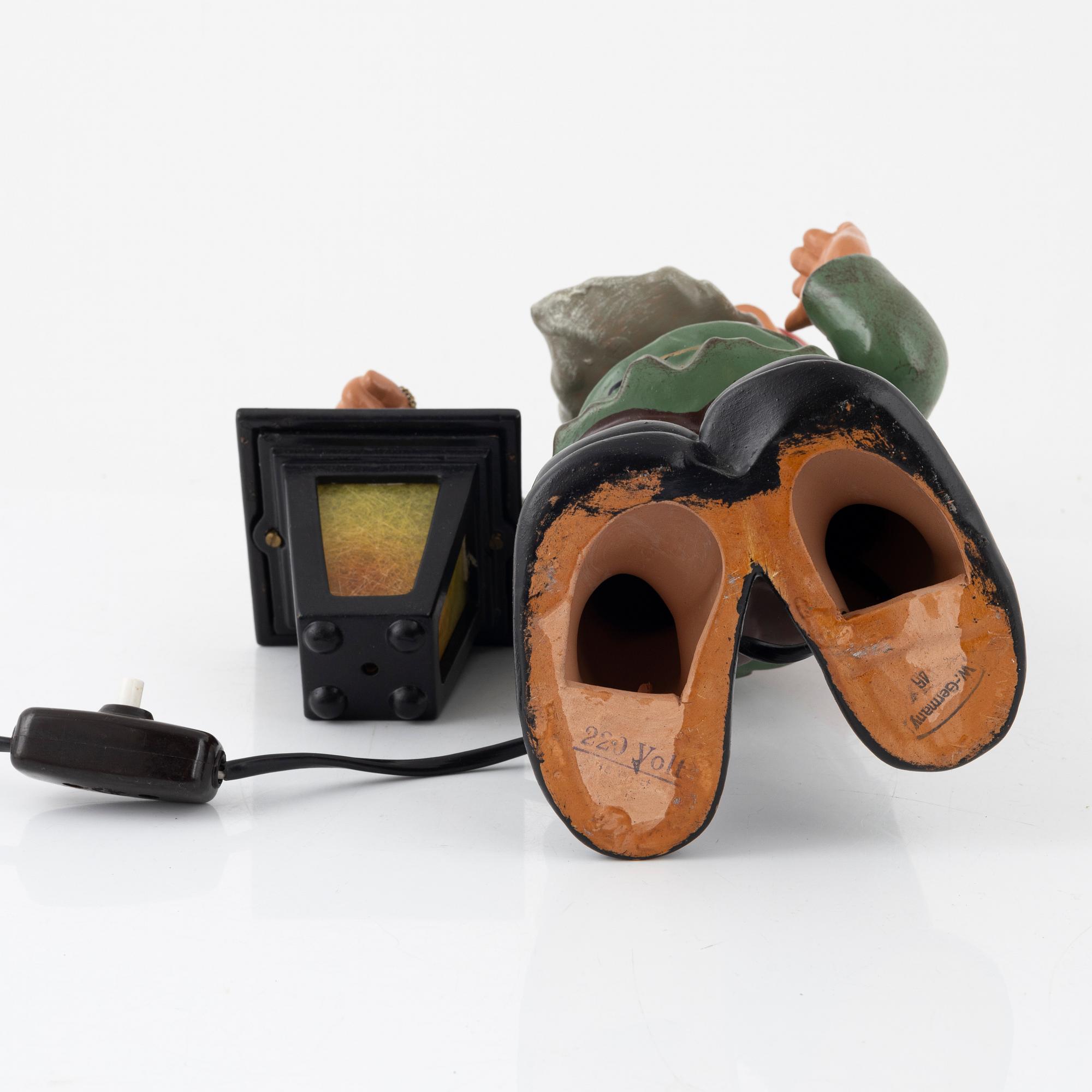 A West German earthenware gnome with lantern from the second half of the 20th century.
