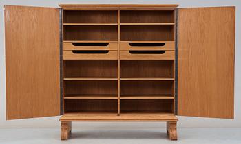 An Otto Schulz oak cabinet, for Boet, Gothenburg 1944, the sides and doors covered in artificial leather.