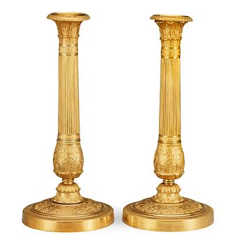 A pair of French Empire early 19th century candlesticks.