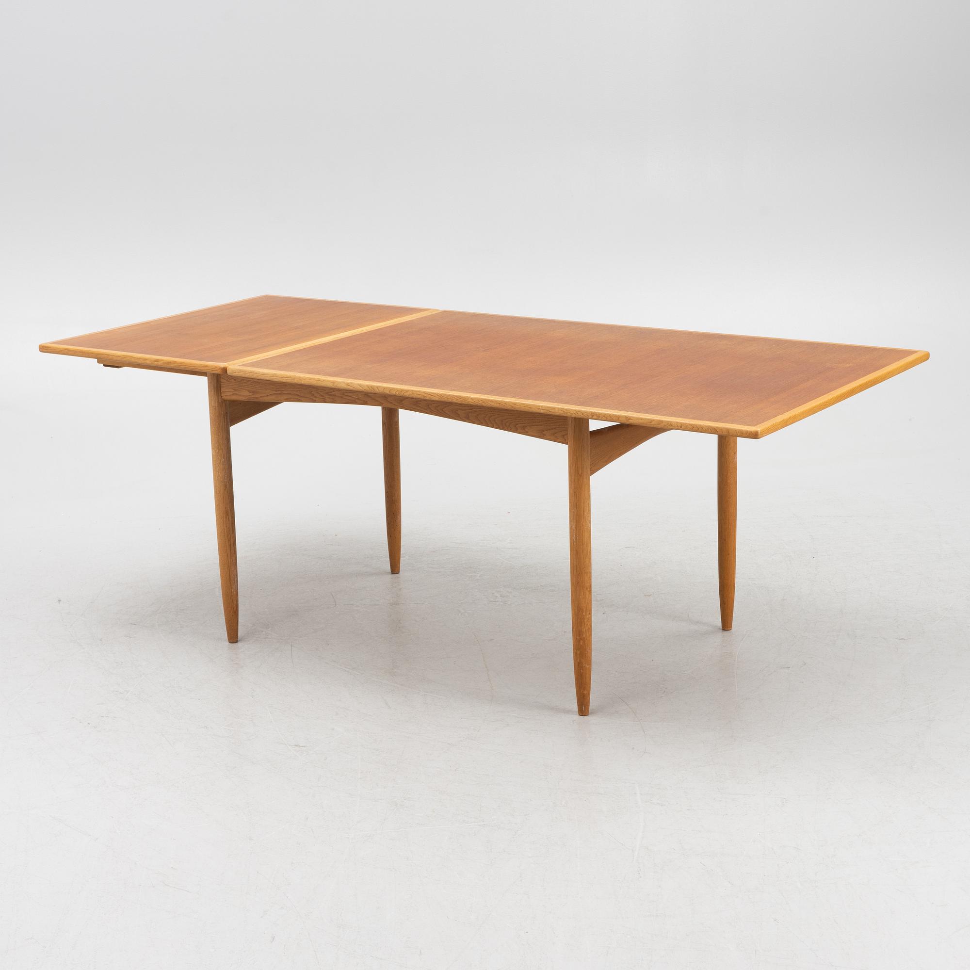 A teak and oak dining table, Scandinavia, 1960's.