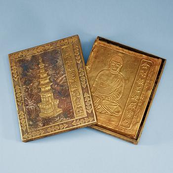 A repousse technique gilt metal box with a book of buddhistic prayers, China.